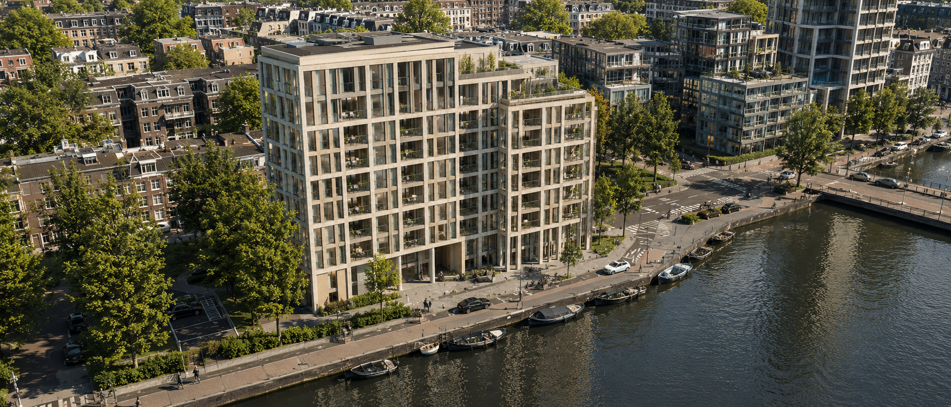 Aerial view of the building along an Amsterdam canal, surrounded by neighbouring blocks and trees